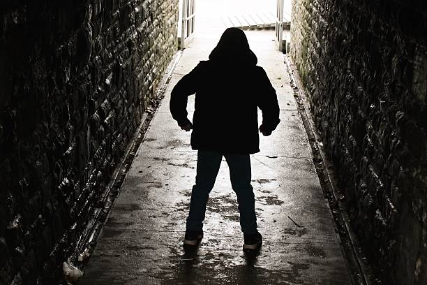 istock Hooded boy standing in an underground tunnel 508138666