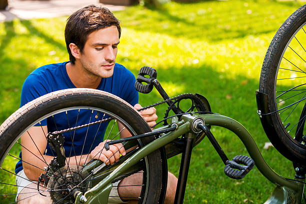 istock Man repairing his bike. 508139709