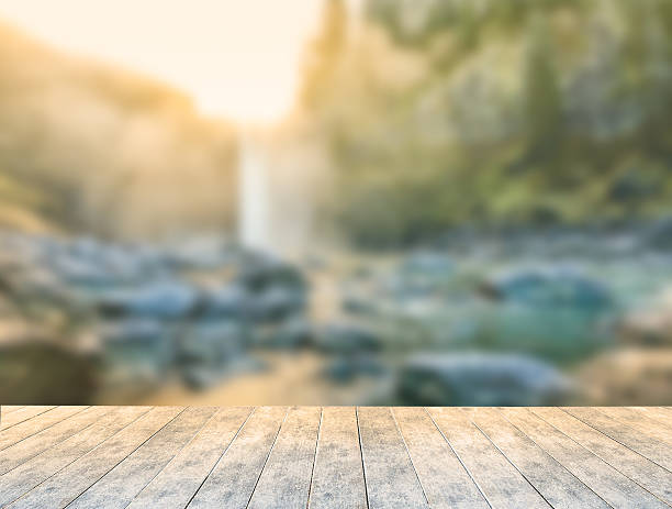 istock ice wooden table with water fall background and snowing 508140290