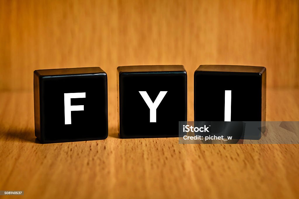 FYI or for your information word on black block FYI or for your information text on black block Acronym Stock Photo