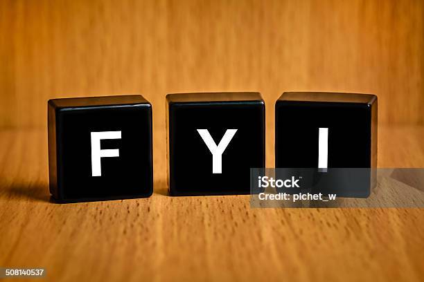 Fyi Or For Your Information Word On Black Block Stock Photo - Download Image Now - Acronym, FYI, Communication