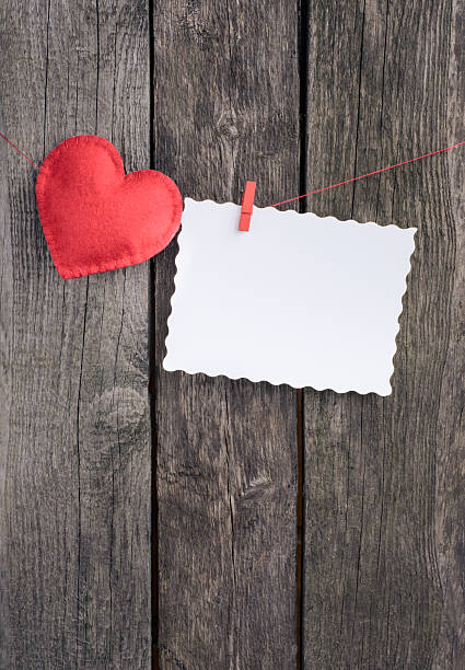 istock Two red hearts on vintage wood background 508140726