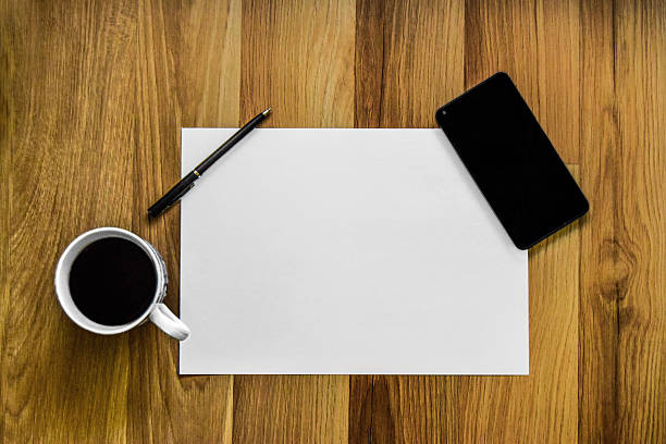 istock Office desk coffee, smart phone and pen 508142122
