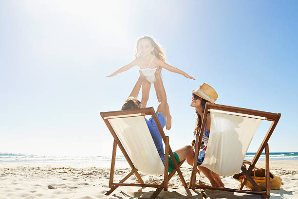 istock Flying over the beach with mom and dad 508145901