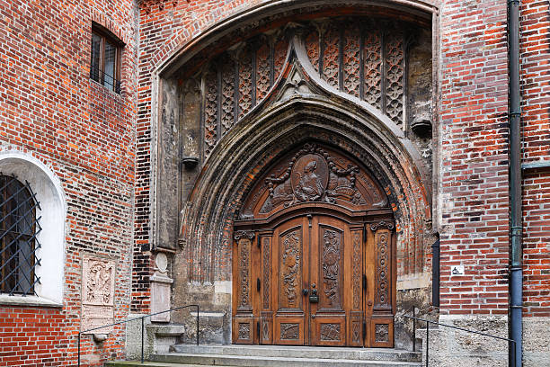 Ornamental door of Frauenkirche in Munich at winter time