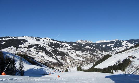 The Alp village Hinterglemm, Austria at winter time. Hinterglemm is part of the Saalbach, Hinterglemm, Leogang, Fieberbrunn Skicircus ski resort area with 270 km ski slopes / ski runs