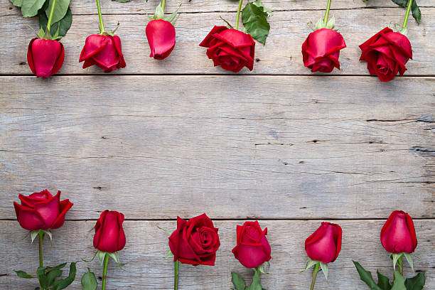 istock Valentines day background with red roses on wooden. 508159150