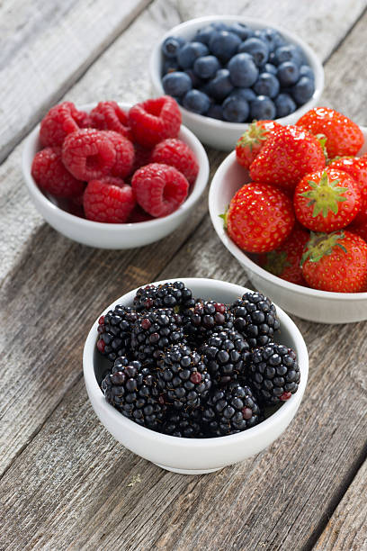 istock blackberries in bowl and fresh garden berries, top view 508162206