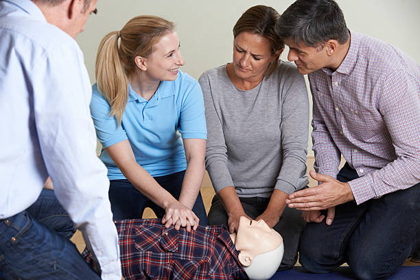istock Woman Demonstrating CPR On Training Dummy In First Aid Class 508163916