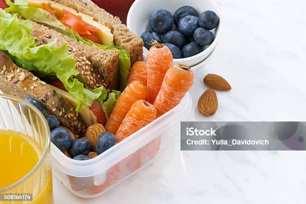 Lunch Box With Sandwich Of Wholemeal Bread On White Background Stock Photo - Download Image Now