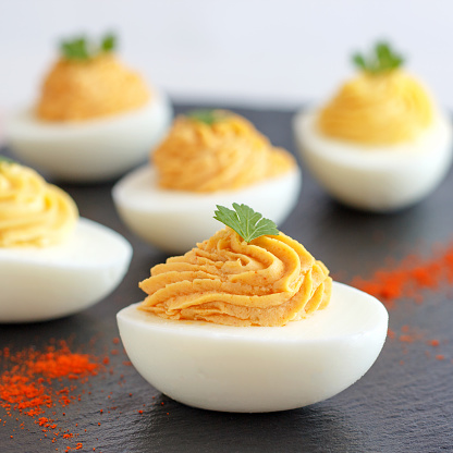 Deviled eggs are one of the party snacks that are easily prepared and people love them.