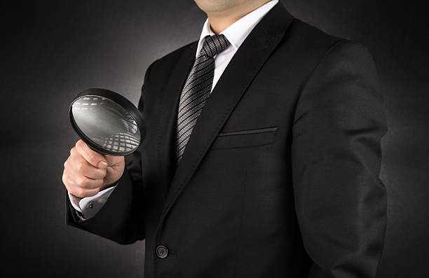 istock Businessman with magnifying glass 508165606