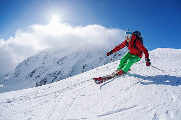 istock Skier skiing downhill in high mountains against sunset 508166447