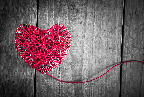 istock Read heart yarn on grunge wood table 508166794