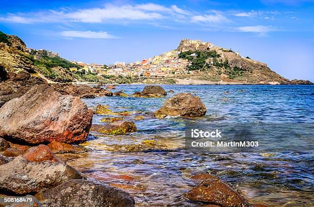 Rocky Ocean Coastline With Colorful Town Castelsardo Italy Stock Photo - Download Image Now