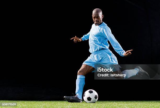 Soccer Player In Action Stock Photo - Download Image Now - Soccer Player, African Ethnicity, Black Color