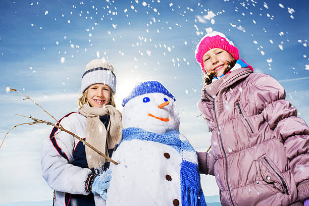 istock Little children making snowman. 508172065