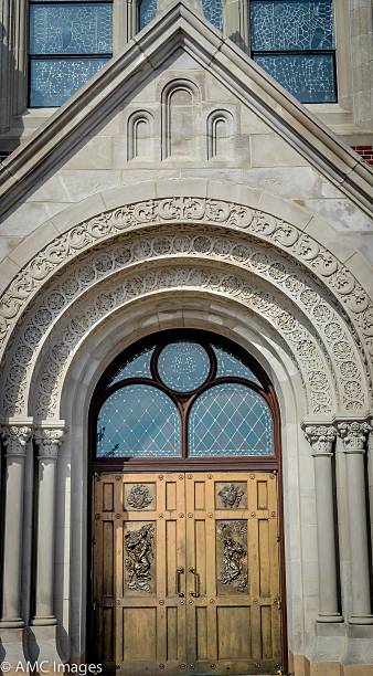 istock Arched ornate church door 508172375