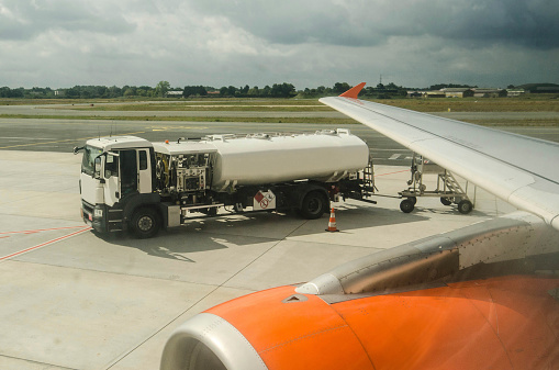 A truck fueling an airplane, seen from the inside