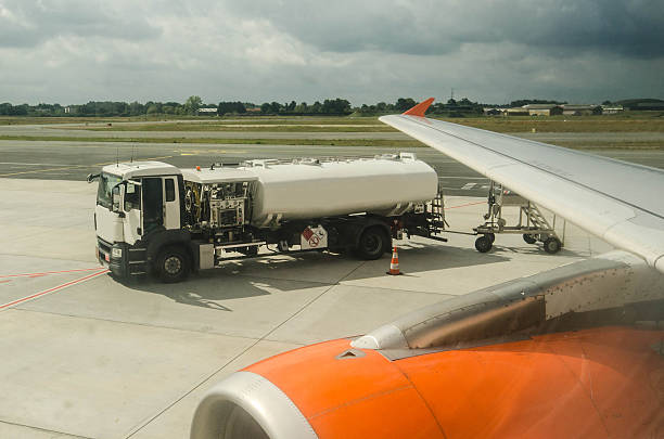 Refueling a plane A truck fueling an airplane, seen from the inside semi truck audio stock pictures, royalty-free photos & images