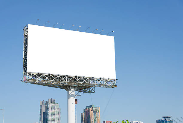 istock large blank billboard on road with city view background 508173249