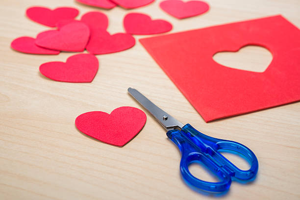 istock Cutting heart shapes from red foam sheets with scissors 508178490