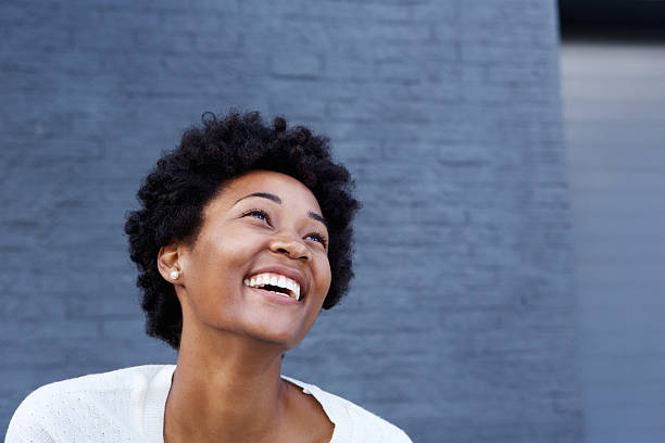istock Smiling young african woman looking at copy space 508180212