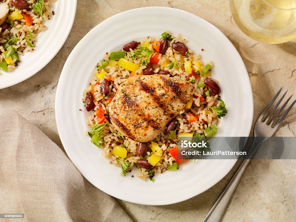 Grilled Chicken with Quinoa and Brown Rice Salad Quinoa and Brown Rice Salad with Peppers and Beans-Photographed on Hasselblad H3D2-39mb Camera Chicken Meat Stock Photo