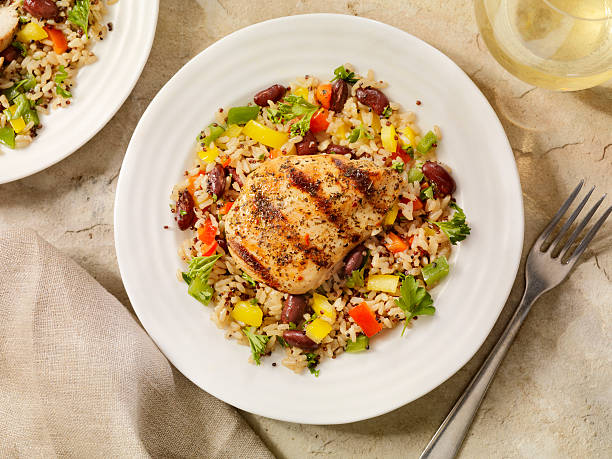 Grilled Chicken with Quinoa and Brown Rice Salad Quinoa and Brown Rice Salad with Peppers and Beans-Photographed on Hasselblad H3D2-39mb Camera beans and rice stock pictures, royalty-free photos & images