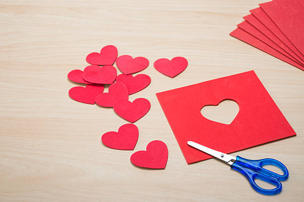 istock Cutting heart shapes from red foam sheets with scissors 508180646
