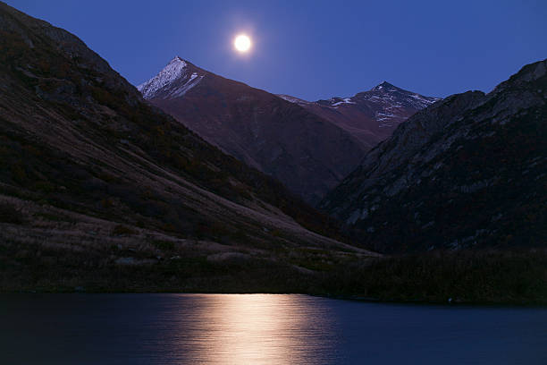 istock Moon over mountain lakes and lunar path. 508180818