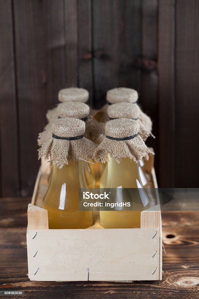 Syrup Bottles with homemade ginger syrup. Can be used as a photo of various kinds of syrup or lemonade. Alternative Medicine Stock Photo