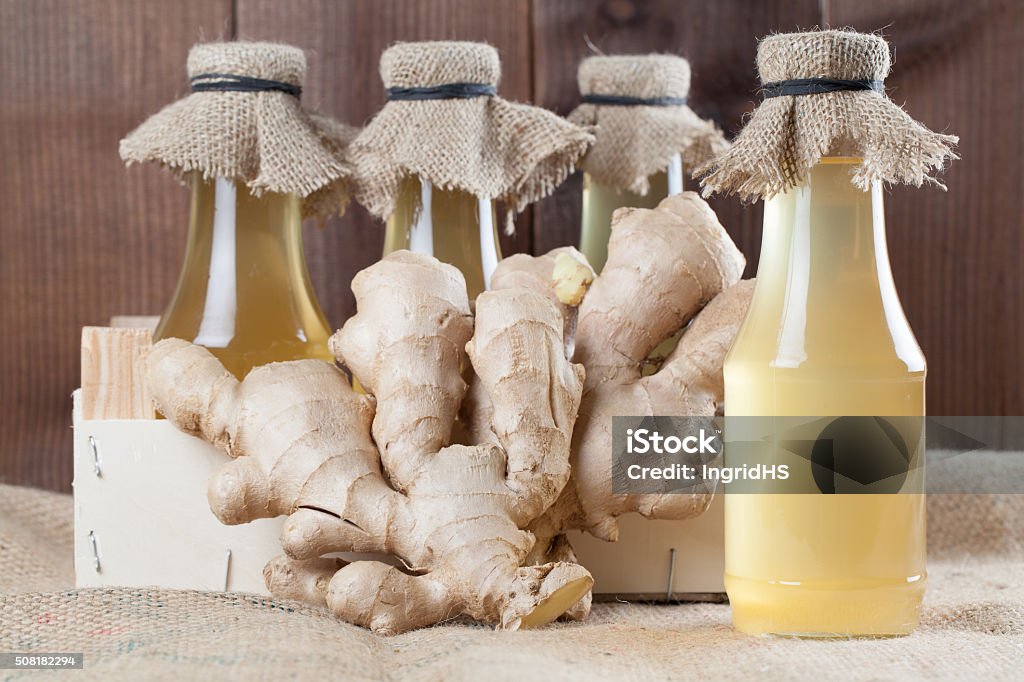 Ginger syrup Bottles with homemade ginger syrup. Shallow dof Alternative Medicine Stock Photo