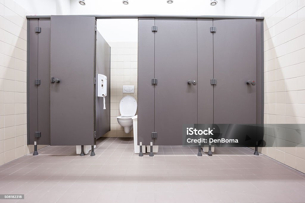 doors from toilets In an public building are womans toilets whit black doors Public Restroom Stock Photo