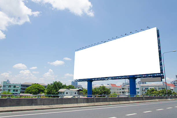 istock large blank billboard on road with city view background 508182597
