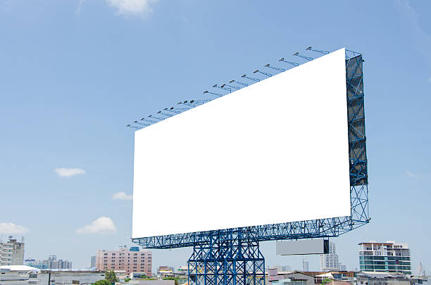 istock large blank billboard on road with city view background 508182613
