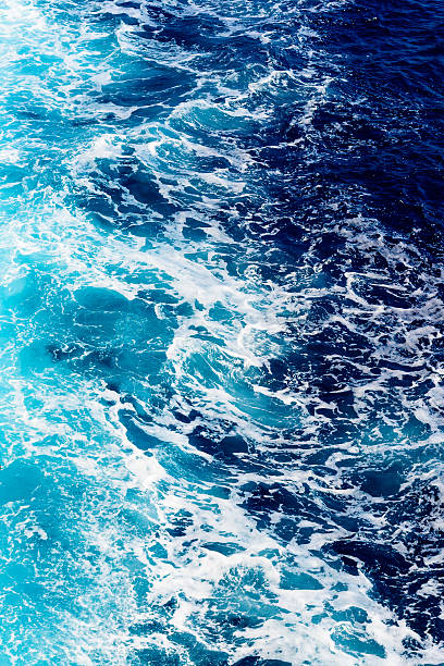 Deep blue sea water with spray stock photo