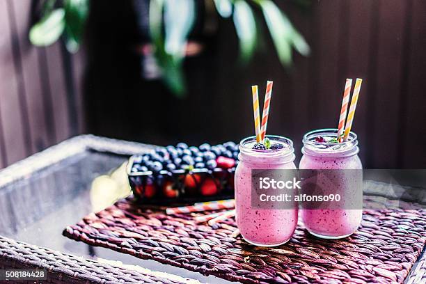 Fresh Berry Smoothies On Mason Jars Stock Photo - Download Image Now - Antioxidant, Backgrounds, Blueberry