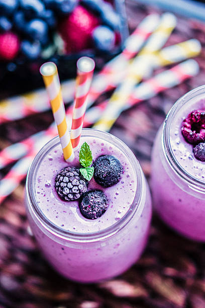 istock Fresh berry smoothies on mason jars 508184486
