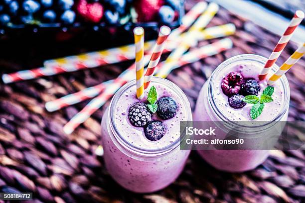 Fresh Berry Smoothies On Mason Jars Stock Photo - Download Image Now - Antioxidant, Backgrounds, Blueberry