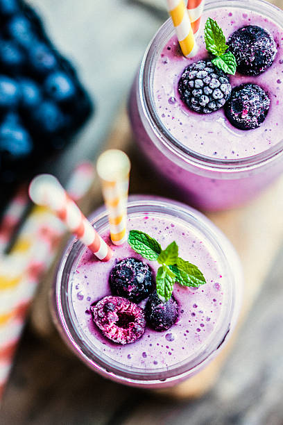 Fresh berry smoothies on mason jars