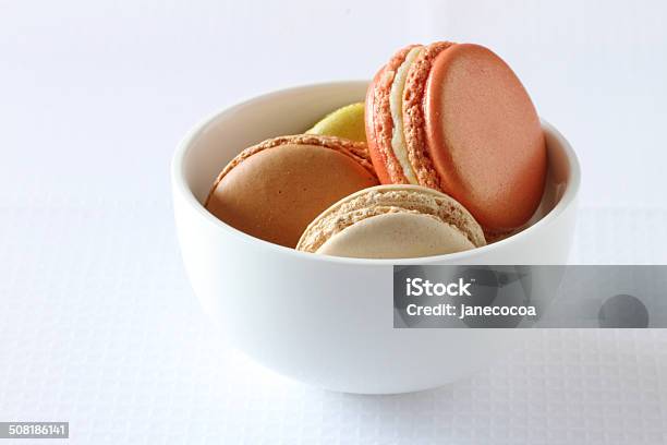 Colourful French Macaroons On White Background Stock Photo - Download Image Now - Backgrounds, Baked, Ceramics