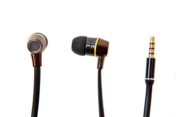 istock Black wired earphones isolated over white 508186552
