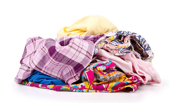 istock Heap of colorful clothes isolated on white 508186734