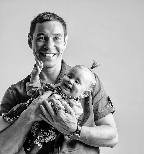 istock Father playing with his daughter holding her in his arms 508186963
