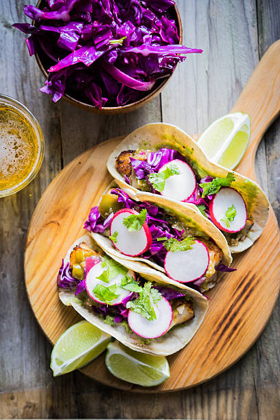 istock Fish tacoes on wooden background 508187002