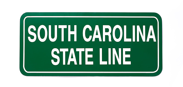 A vintage steel official road sign from South Carolina.