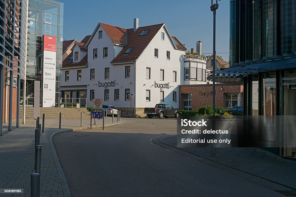 Outlet City Metzingen Metzingen, Germany - August 5, 2014: Factory outlet, outlet city Metzingen, Baden Württemberg, Germany. Metzingen is one of the largest outlet centers in Germany. Here to see the shopping center by Tom Tailor, Schiesser, Seidensticker and bugatti. With over 3.5 million visitors from 185 countries annually the Outlet City Metzingen is one of the most successful factory outlets in Europe. More than 60 top brands in elegant flagship outlets. Baden-Württemberg Stock Photo