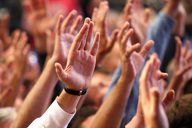 istock raised up a human hands at the event 508190764