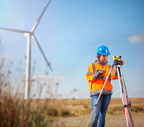 istock female surveyor on a windfarm 508192844